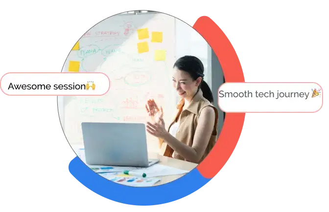 woman smiling looking at her computer